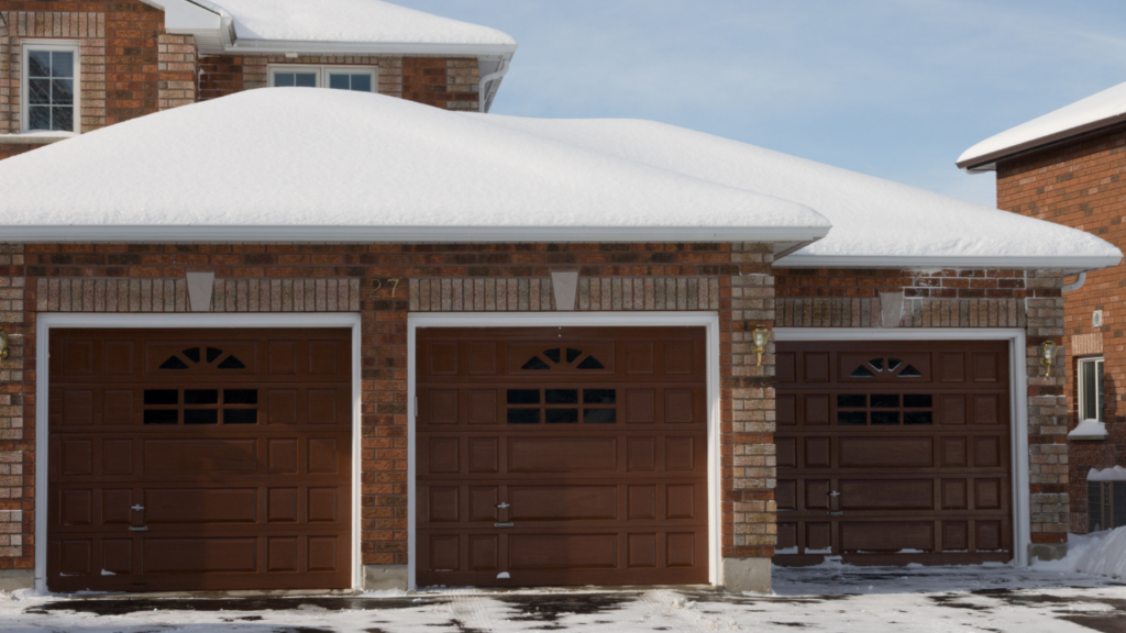 Garage with snow on roof